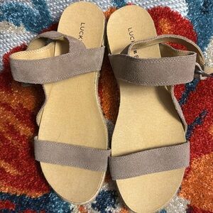 ladies used size 8 Lucky Brand buckle sandals tan color